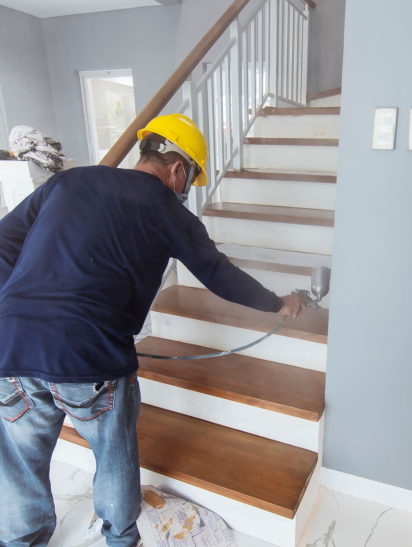man_spray_painting_stairs